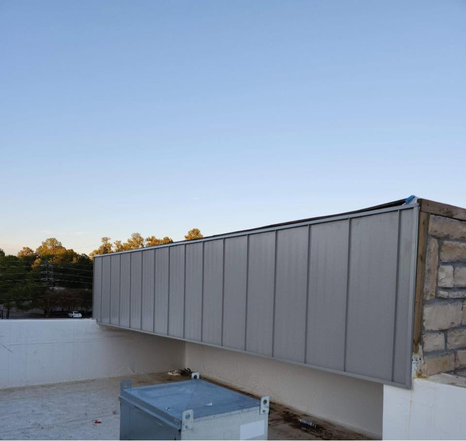 Commercial roofing system with metal wall panels in Shreveport, LA.