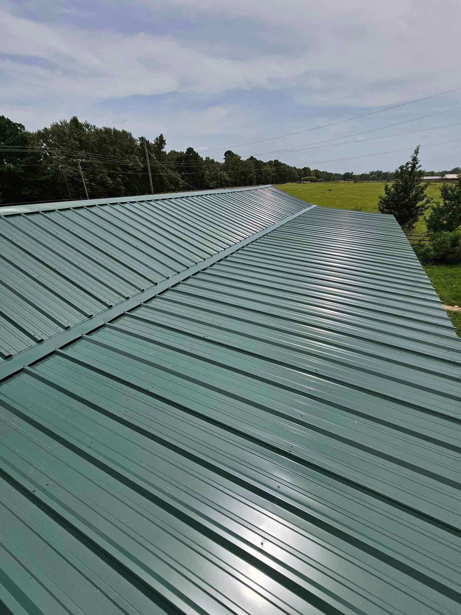 Green metal roof installation on a property in Shreveport, LA.