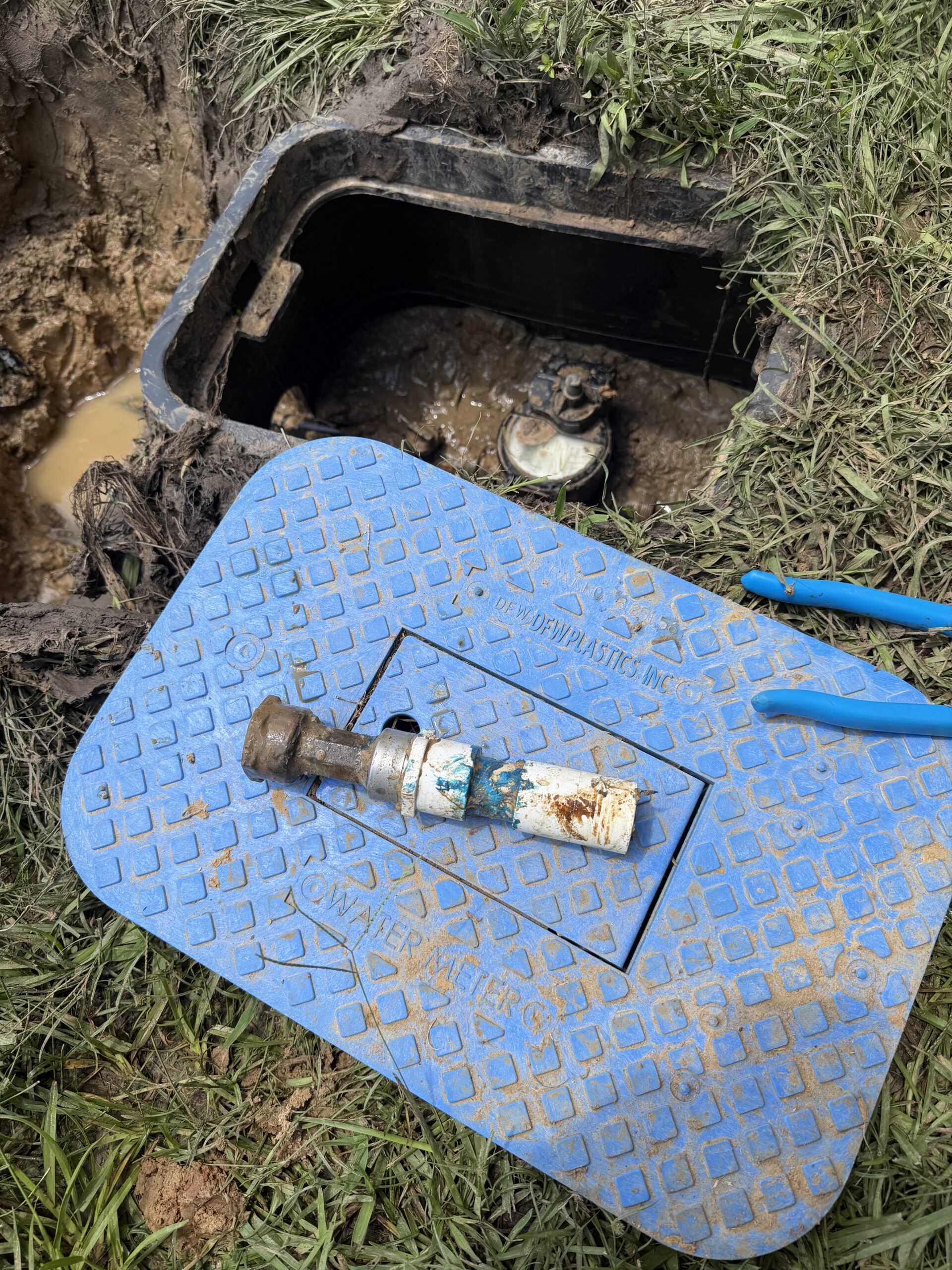 Blue Note Pros plumbing repair at an outdoor water meter in Shreveport, LA.