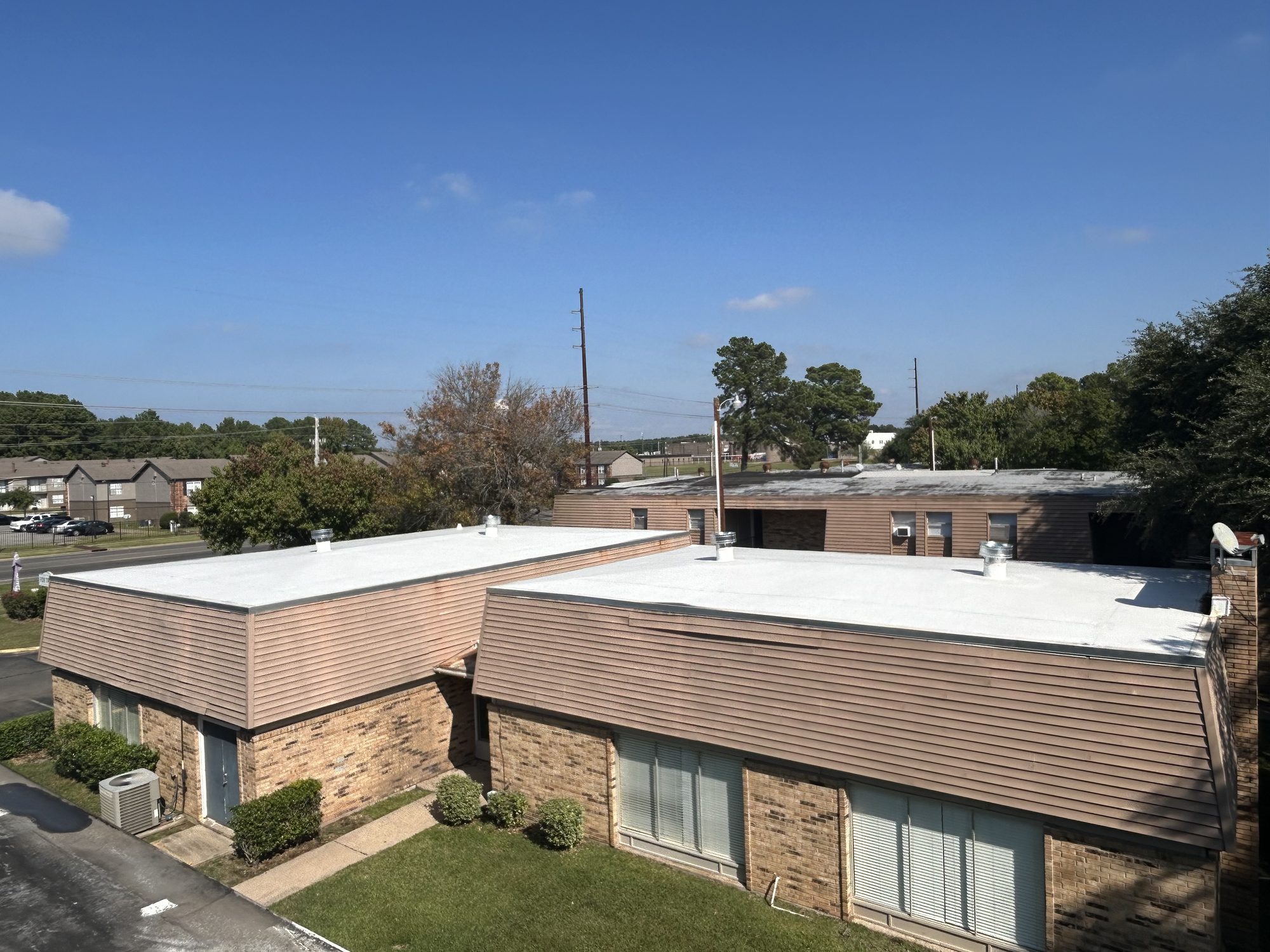 Commercial TPO roof replacement on a multi-unit building by Blue Note Pros