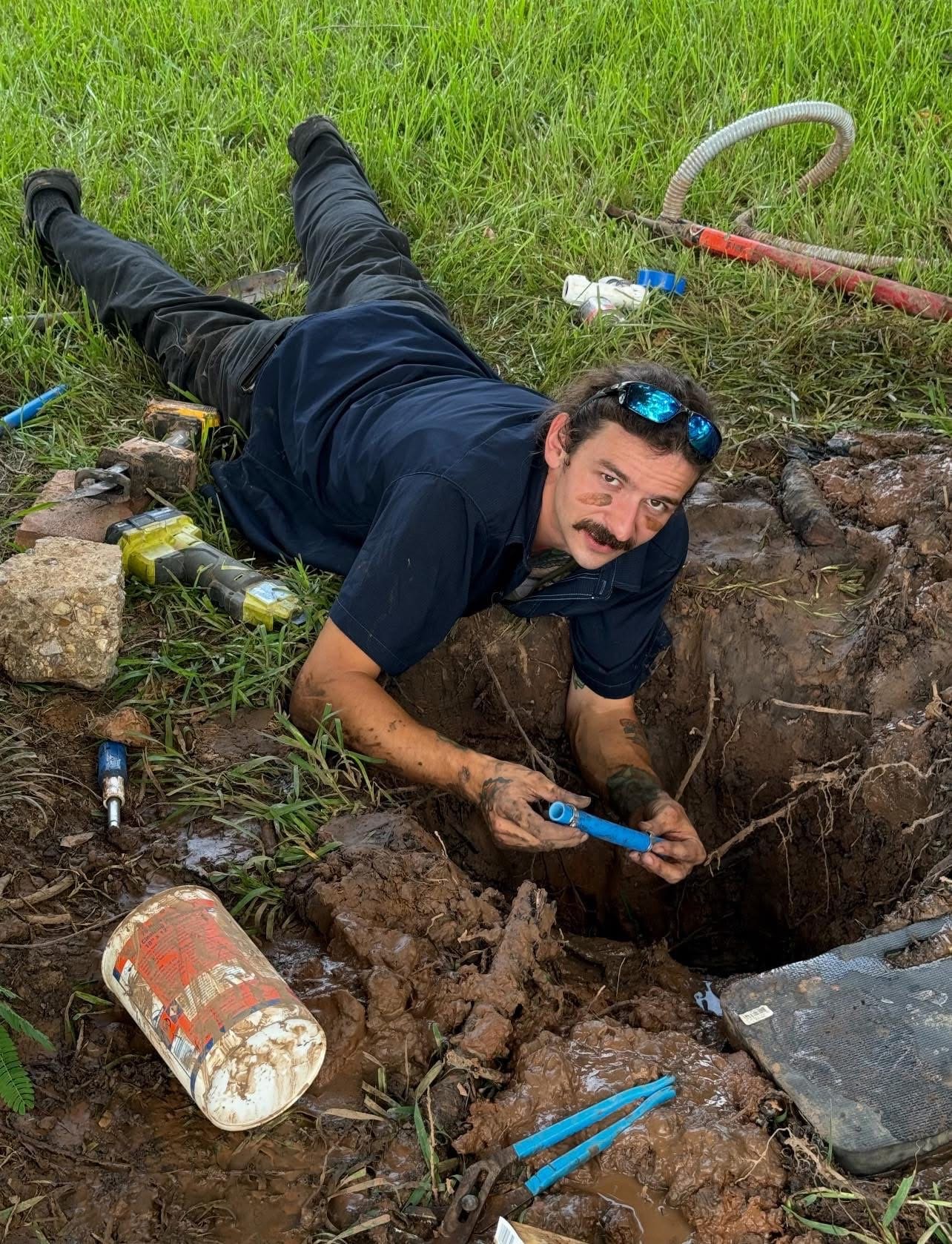 Blue Note Pros plumbing contractor Trace Martin repairing a buried pipe in Shreveport, LA.